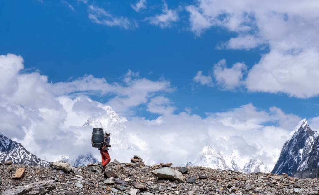 a-man-standing-on-k2-base-camp