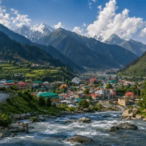 Panoramic landscape view of Naran Valley with the Kunhar River flowing past green mountains and Naran town in Khyber Pakhtunkhwa Pakistan.