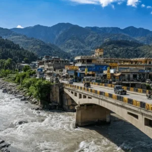 Comprehensive view of the town buildings, market area, and river bridges in Balakot.